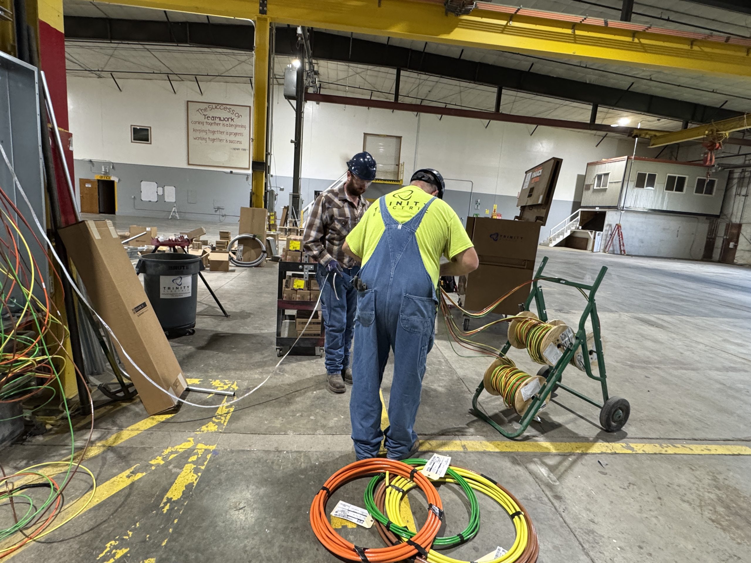 Industrial electrical wiring installation inside a metal fabrication facility
